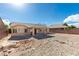 Large backyard with rock landscaping and patio and a view of the single-story home at 5582 Little Lake Ave, Las Vegas, NV 89122