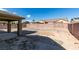 Spacious backyard featuring rock landscaping, a privacy wall, and a covered patio at 5582 Little Lake Ave, Las Vegas, NV 89122