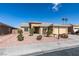 Beautiful front yard view featuring desert landscaping, a well manicured lawn, and mature trees at 5582 Little Lake Ave, Las Vegas, NV 89122