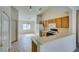 Kitchen area features breakfast bar, stainless steel appliances, and ample cabinets at 5582 Little Lake Ave, Las Vegas, NV 89122