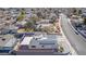 An aerial view showcasing a single story home with solar panels and a large yard at 601 Sierra Ln, Henderson, NV 89002