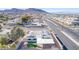 Aerial view showing a single-story home with solar panels and a backyard at 601 Sierra Ln, Henderson, NV 89002