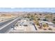 Aerial view of a single-story home near a commercial district, showcasing desert landscaping and mountain views at 601 Sierra Ln, Henderson, NV 89002