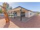 Home exterior showcasing a covered patio and landscaped yard at 601 Sierra Ln, Henderson, NV 89002