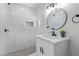 Updated bathroom with marble tile shower, modern vanity, and stylish fixtures at 601 Sierra Ln, Henderson, NV 89002