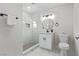 Stylish bathroom with marble-look tile, updated vanity, fixtures, and a walk-in shower with tiled niche at 601 Sierra Ln, Henderson, NV 89002