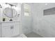 Updated bathroom features a white vanity, marble shower, and hexagon floor tiles at 601 Sierra Ln, Henderson, NV 89002