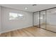 Bright bedroom with mirrored closet and wood-look floors at 601 Sierra Ln, Henderson, NV 89002