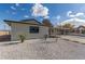 Single story home with carport, landscaped yard, and updated exterior at 601 Sierra Ln, Henderson, NV 89002