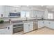 Updated kitchen featuring white cabinets and gray countertops at 601 Sierra Ln, Henderson, NV 89002