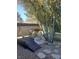 Landscaped backyard with a wooden footbridge and stone path at 6136 Evensail Dr, Las Vegas, NV 89156