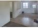 Living room with tile floor, partial view of kitchen and access to backyard at 6136 Evensail Dr, Las Vegas, NV 89156