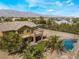 Two-story house with pool, putting green, and mountain views at 6165 Smarty Jones Ave, Las Vegas, NV 89131