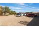 Gravel area with cars parked in the backyard at 6165 Smarty Jones Ave, Las Vegas, NV 89131