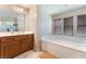 Bathroom with soaking tub and double sinks at 6165 Smarty Jones Ave, Las Vegas, NV 89131