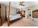 Bedroom with a wooden four poster bed and ceiling fan at 6165 Smarty Jones Ave, Las Vegas, NV 89131