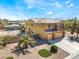 Two-story house with attached garage and pool in background at 6165 Smarty Jones Ave, Las Vegas, NV 89131