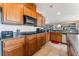 Kitchen with gas range and ample wood cabinets at 6165 Smarty Jones Ave, Las Vegas, NV 89131