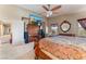 Main bedroom with a king-size bed and access to the bathroom at 6165 Smarty Jones Ave, Las Vegas, NV 89131