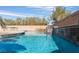 Inviting swimming pool with stone detailing at 6165 Smarty Jones Ave, Las Vegas, NV 89131