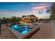 Backyard oasis with a pool and spa at sunset at 6165 Smarty Jones Ave, Las Vegas, NV 89131