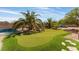 Landscaped backyard with putting green at 6165 Smarty Jones Ave, Las Vegas, NV 89131