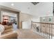 Upstairs hallway with a view of the living room and staircase at 6165 Smarty Jones Ave, Las Vegas, NV 89131