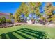 Landscaped backyard with artificial turf and disc golf at 6185 N Conquistador St, Las Vegas, NV 89149