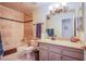 Bathroom with tub, shower, and granite vanity at 6185 N Conquistador St, Las Vegas, NV 89149