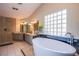 Elegant bathroom boasting a soaking tub and a walk-in shower at 6185 N Conquistador St, Las Vegas, NV 89149