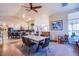 Open concept dining area with large table and view into kitchen at 6185 N Conquistador St, Las Vegas, NV 89149