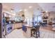 Spacious kitchen featuring granite countertops, stainless steel appliances, and an island at 6185 N Conquistador St, Las Vegas, NV 89149