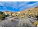 Landscaped backyard with a circular path, desert plants and mountain views at 7079 Mountridge Dr, Las Vegas, NV 89110