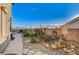 Landscaped backyard with a pathway, desert plants and mountain views at 7079 Mountridge Dr, Las Vegas, NV 89110