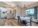 Spacious dining area with wood floors and large window at 7079 Mountridge Dr, Las Vegas, NV 89110