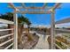 Landscaped garden path with pergola and plants at 7079 Mountridge Dr, Las Vegas, NV 89110