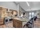 Modern kitchen with stainless steel appliances, custom cabinetry, and stone backsplash at 7079 Mountridge Dr, Las Vegas, NV 89110