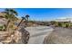 Concrete patio with desert landscaping and seating at 7079 Mountridge Dr, Las Vegas, NV 89110