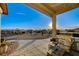 Covered patio with seating area, grill and mountain views at 7079 Mountridge Dr, Las Vegas, NV 89110