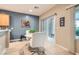 Breakfast nook with light wood floors and sliding glass door to patio at 7517 Lintwhite St, North Las Vegas, NV 89084