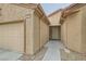 Front entryway with a decorative door and walkway at 7517 Lintwhite St, North Las Vegas, NV 89084