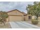 Single-story home with beige exterior and a two-car garage at 7517 Lintwhite St, North Las Vegas, NV 89084