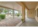 Covered patio with brick pavers, offering a relaxing outdoor space at 7517 Lintwhite St, North Las Vegas, NV 89084