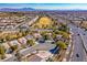 Aerial view of homes situated near a golf course at 7568 Lily Trotter St, North Las Vegas, NV 89084