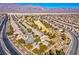 Aerial view of community near golf course and mountains at 7568 Lily Trotter St, North Las Vegas, NV 89084