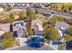 Aerial view of houses with solar panels and a golf course at 7568 Lily Trotter St, North Las Vegas, NV 89084