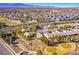 Aerial view showcasing neighborhood by golf course at 7568 Lily Trotter St, North Las Vegas, NV 89084