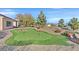 Landscaped backyard with putting green at 7568 Lily Trotter St, North Las Vegas, NV 89084