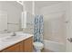 Clean bathroom with shower/tub combo, vanity and cabinet at 7568 Lily Trotter St, North Las Vegas, NV 89084