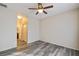 Bedroom with wood-look floors and access to bathroom at 7909 Dutch Canyon Ct, Las Vegas, NV 89131